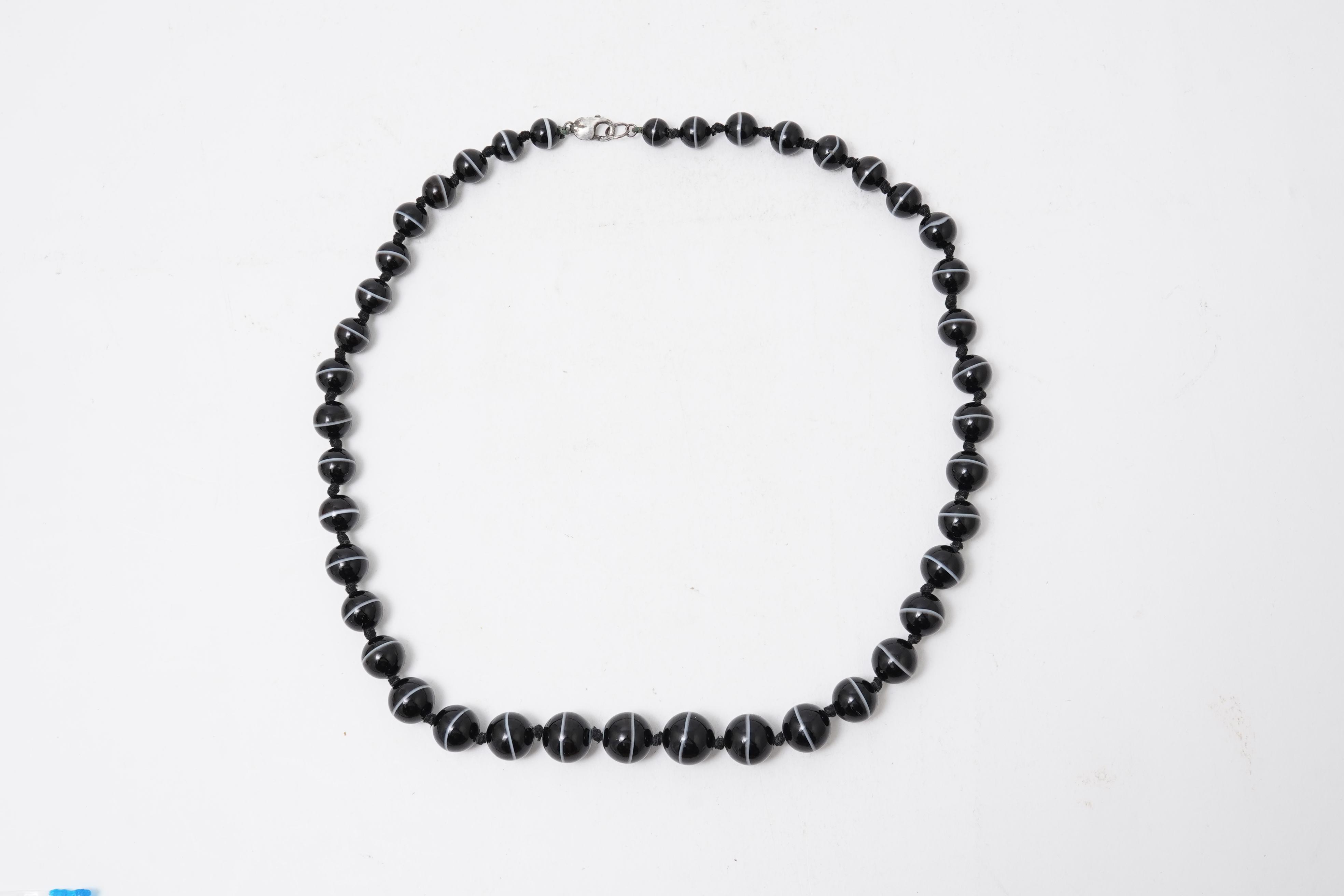 A banded onyx bead necklace, early 20th century